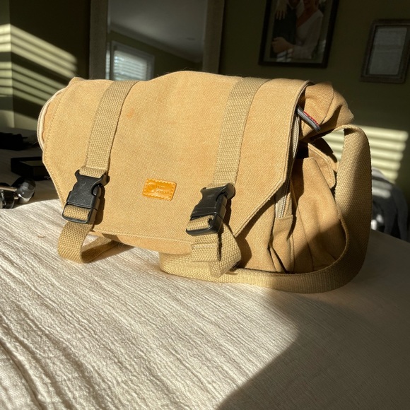 Nikon D3100 with camera bag, charger, lens, and tripod - Picture 8 of 9